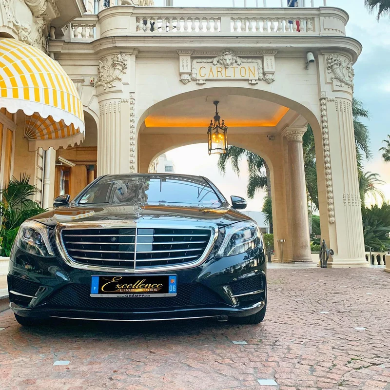 Black Mercedes S-Class with an Excellence presentation plate outside the Carlton Cannes entrance in 2020.